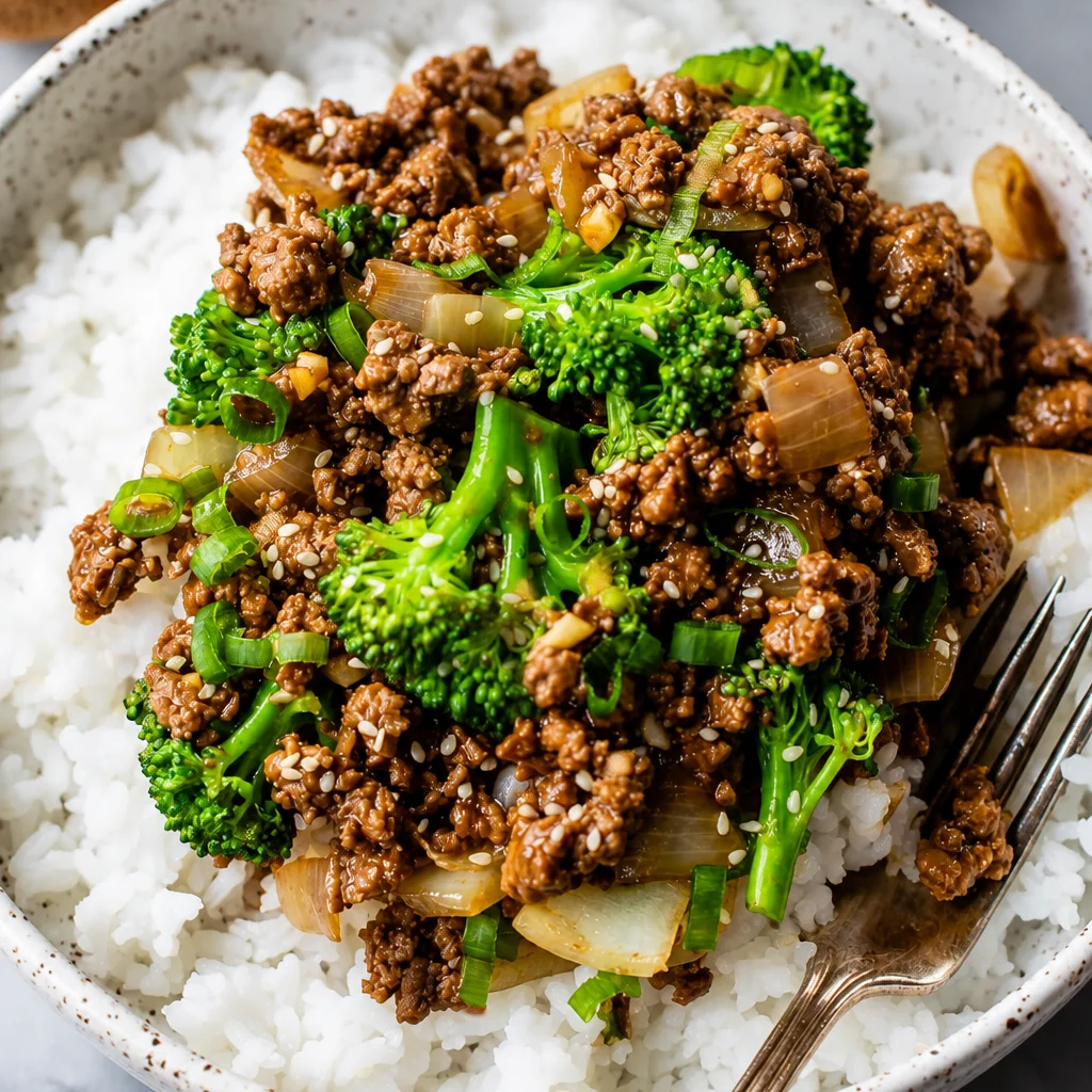Ground beef and broccoli stir-fry with garlic ginger sauce served over rice.